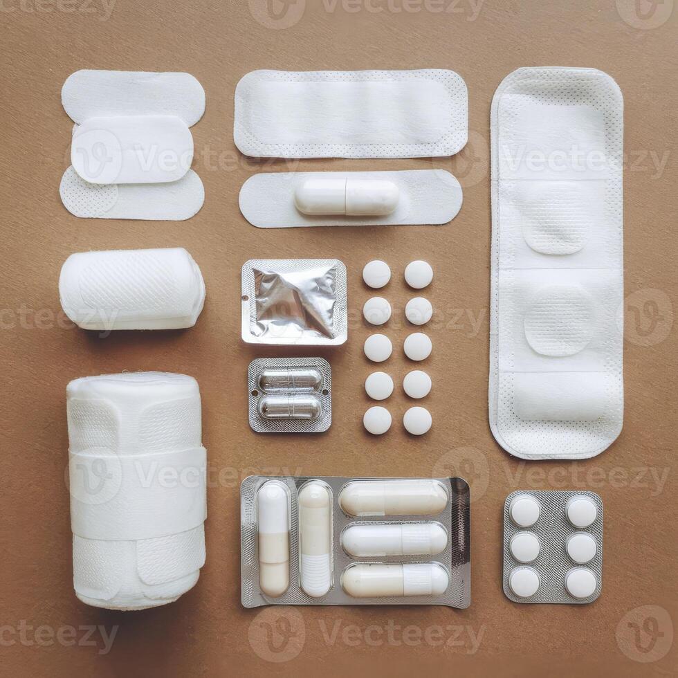 Various medical supplies laid out on a brown surface photo