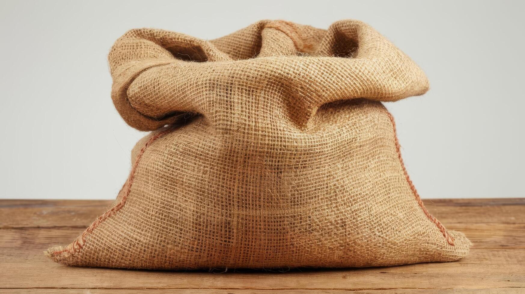 Closed burlap sack isolated on white photo