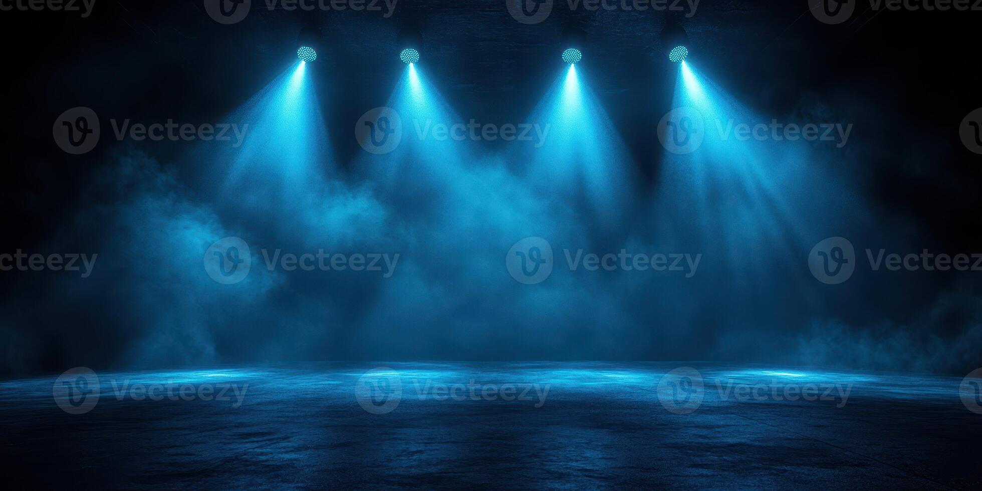 Dramatic blue lighting illuminates an empty stage with misty atmosphere ahead of a performance photo