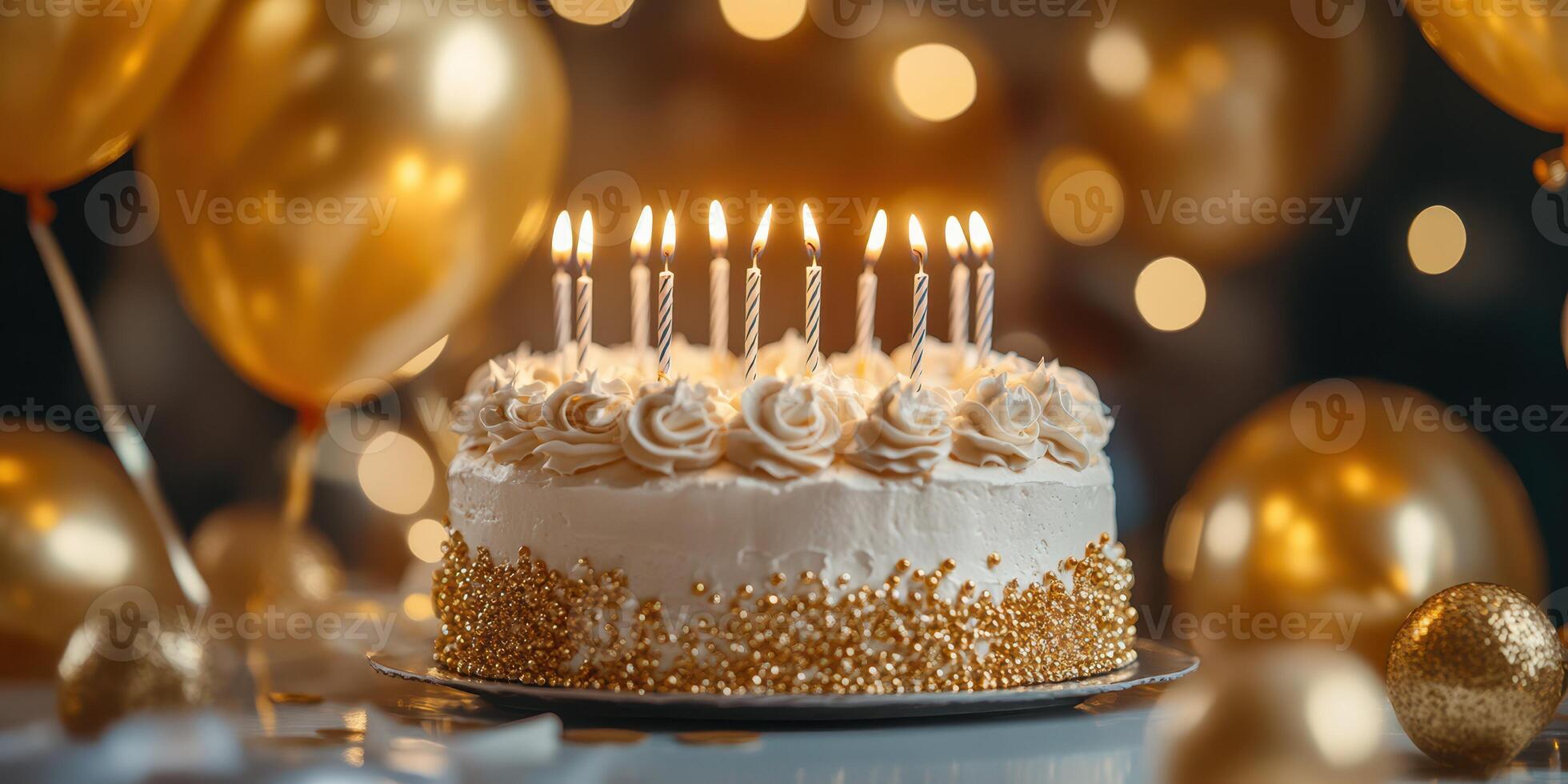 Celebration cake with candles and golden decorations at a festive event photo