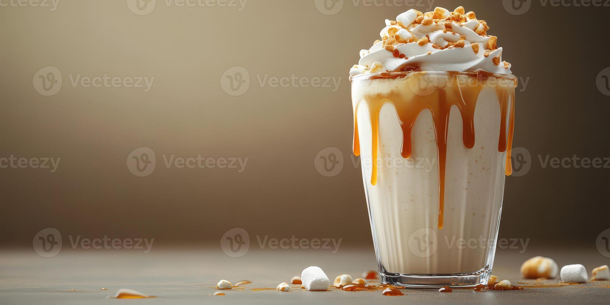 Creamy dessert in a glass topped with whipped cream, caramel, and crushed nuts served indoors with a soft background photo