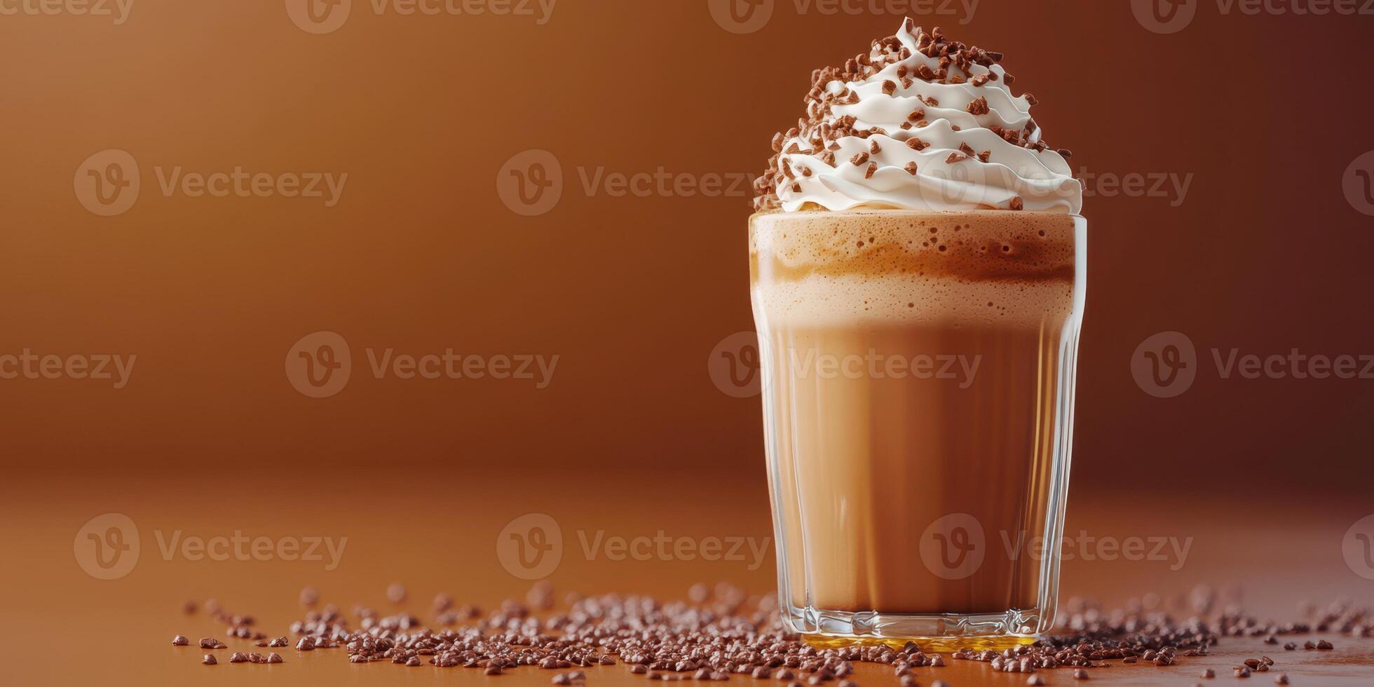 Indulgent chocolate beverage topped with whipped cream and chocolate shavings in warm setting photo