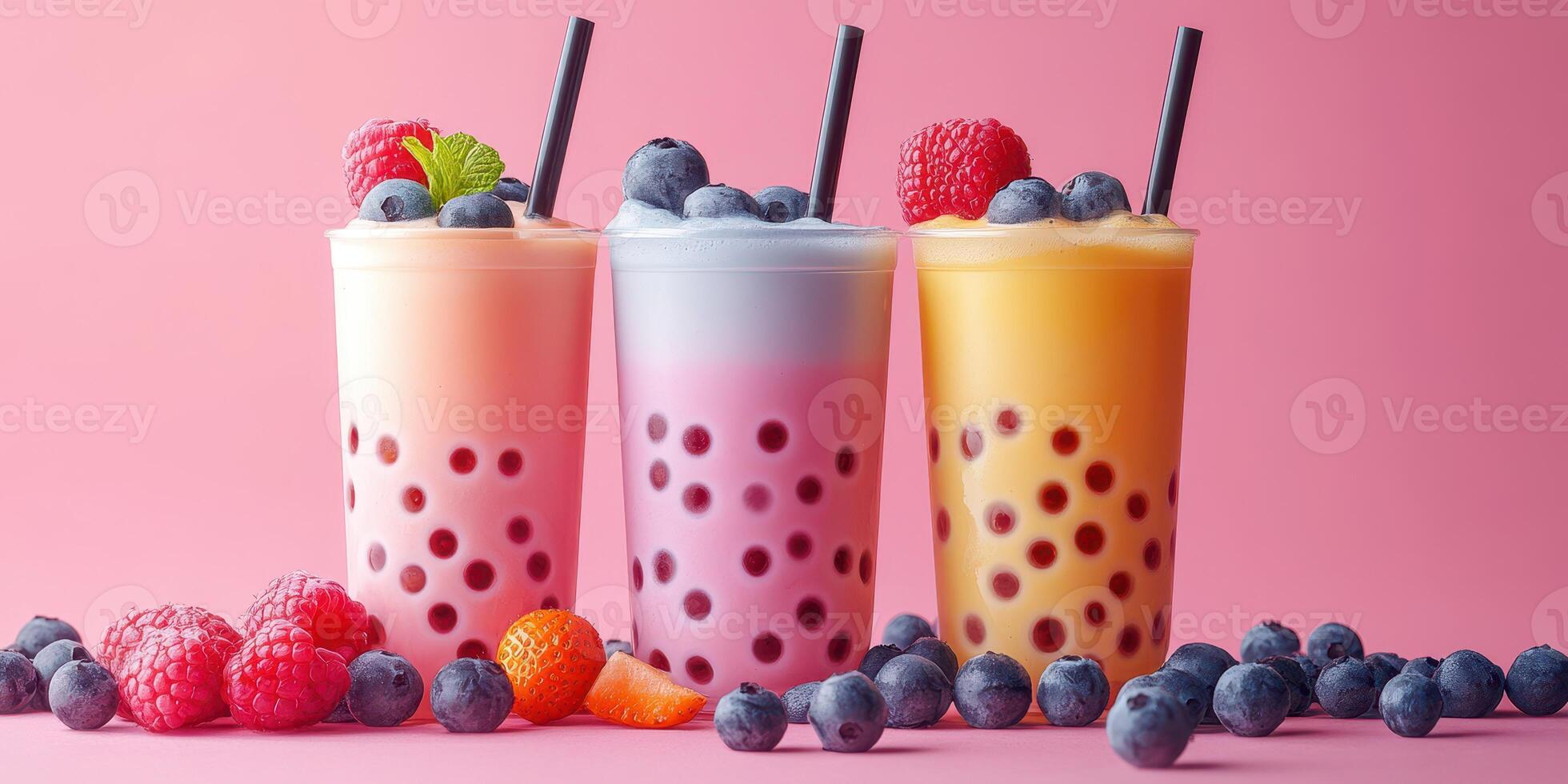 Colorful bubble tea drinks with fresh fruits on a pink background at a lively cafe setting for a summer refreshment photo