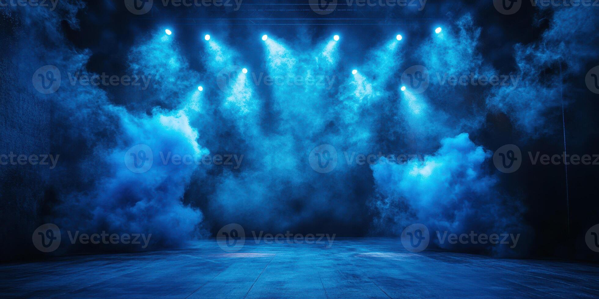 Stage illuminated by blue lights and fog creates an atmospheric performance setting for artists at night photo