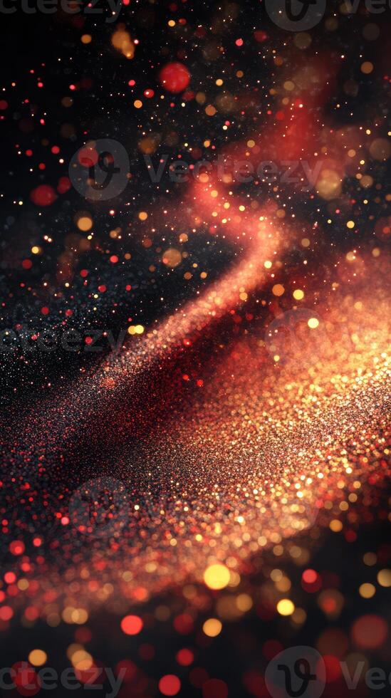 Glowing particles create a mesmerizing abstract design in vibrant red, gold, and black tones during evening hours photo