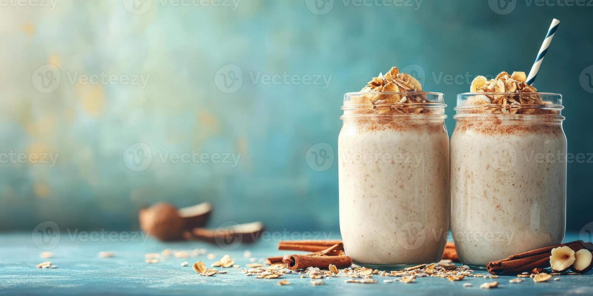 Delicious overnight oat smoothies topped with nuts and spices in rustic glass jars on a textured background photo