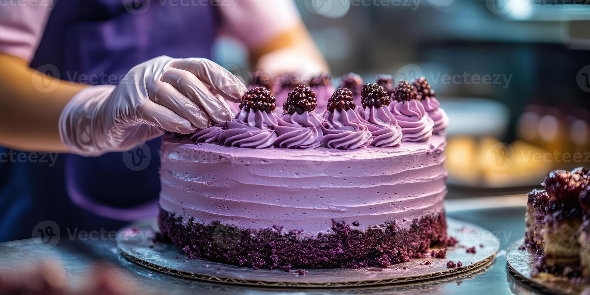 Expert baker decorates a stunning purple cake at a bakery in the afternoon light photo