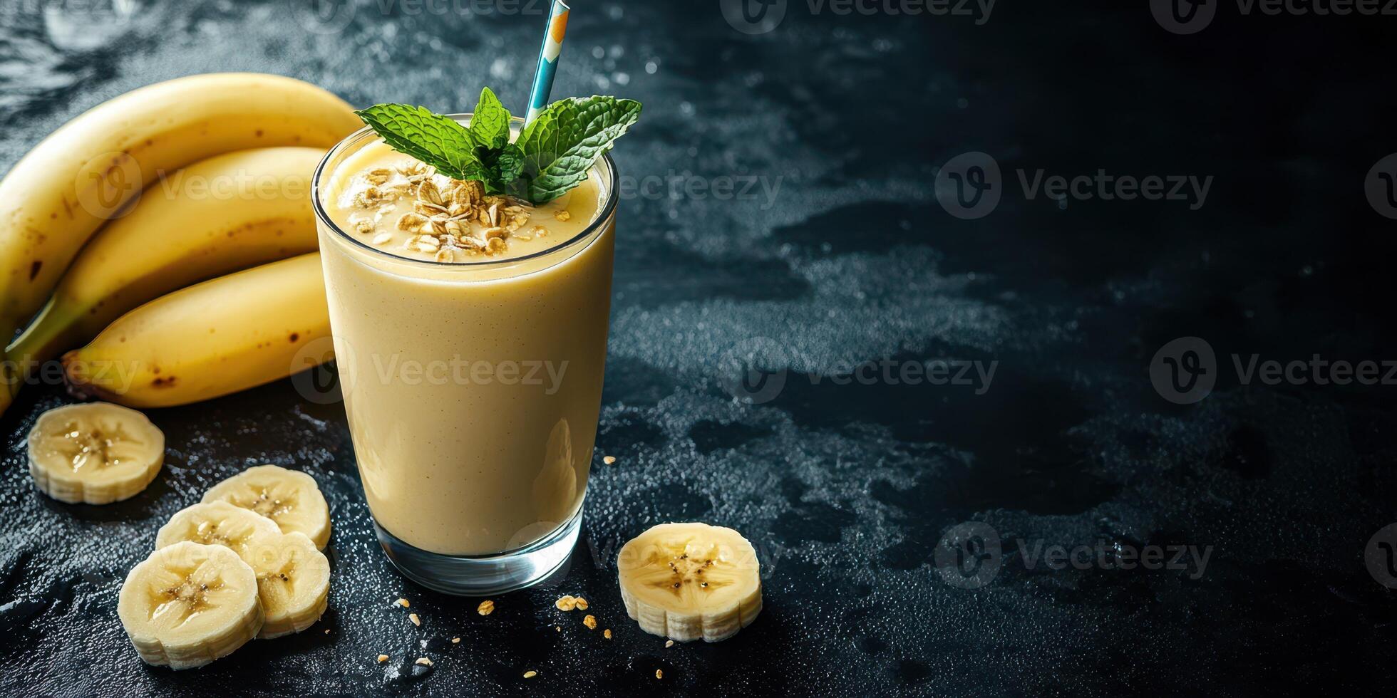 Delicious banana smoothie with fresh mint and oats on a dark background photo