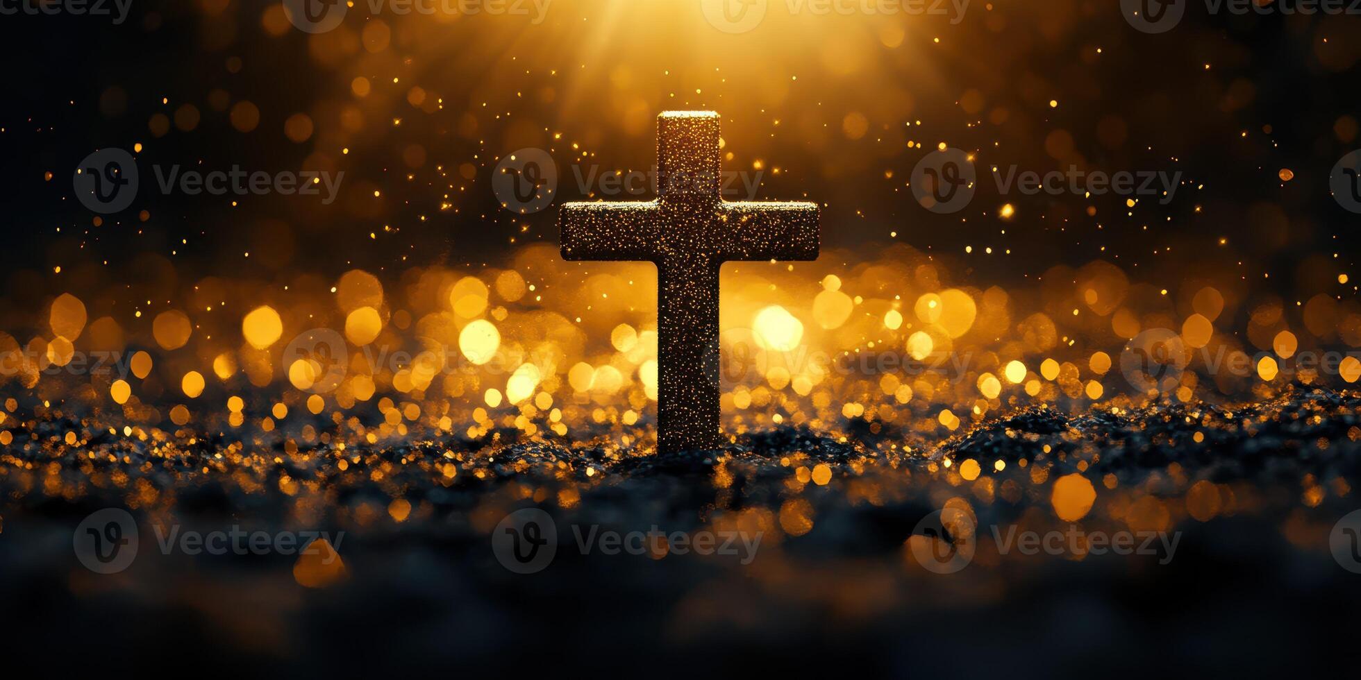 Glowing cross illuminated by soft golden light against a dark shimmering background photo