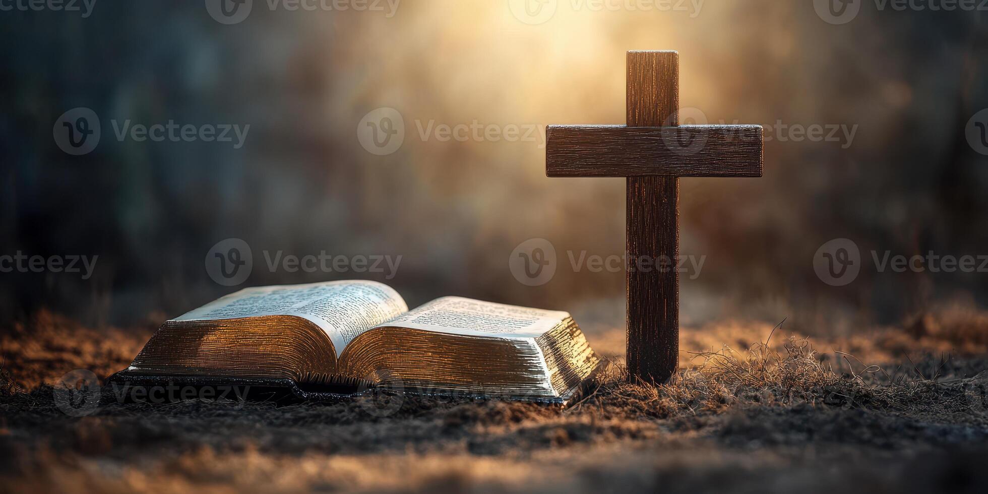Cross and open Bible resting on a textured surface with light illuminating the background in a serene, spiritual setting photo