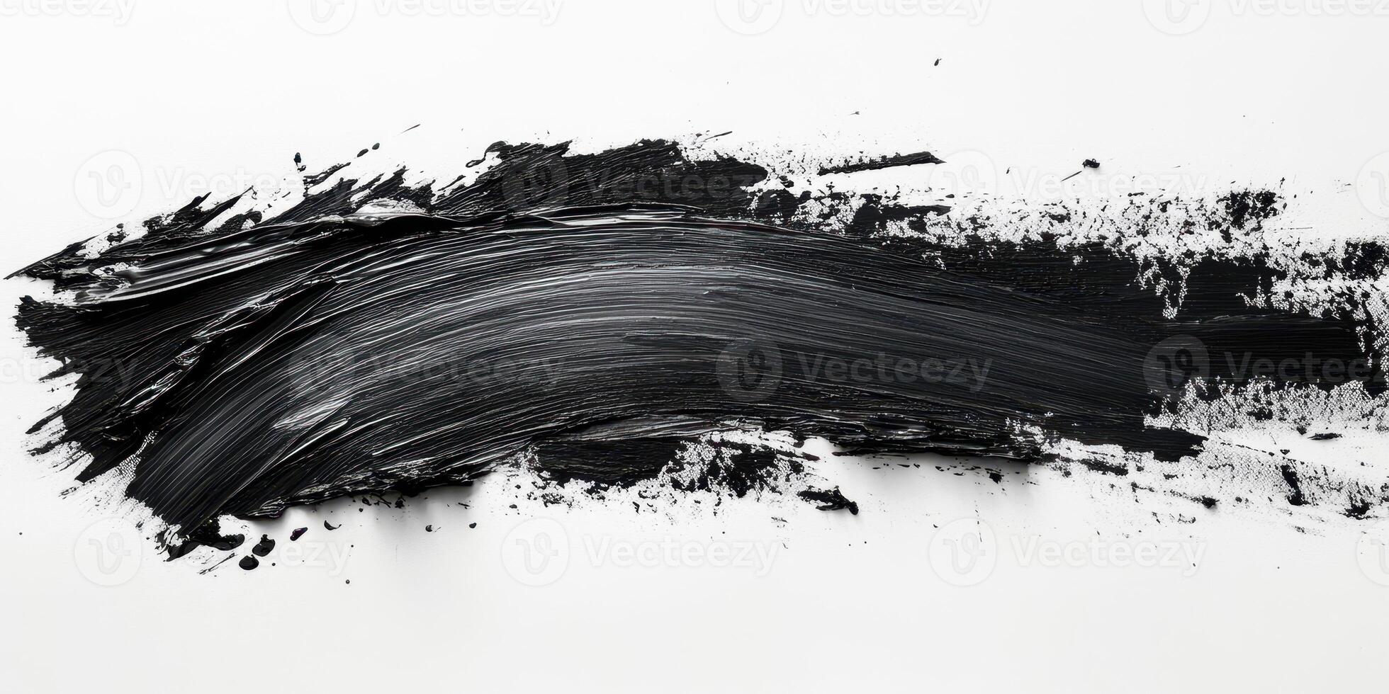 Bold black acrylic paint stroke on a white canvas creating a striking contrast in abstract art composition photo