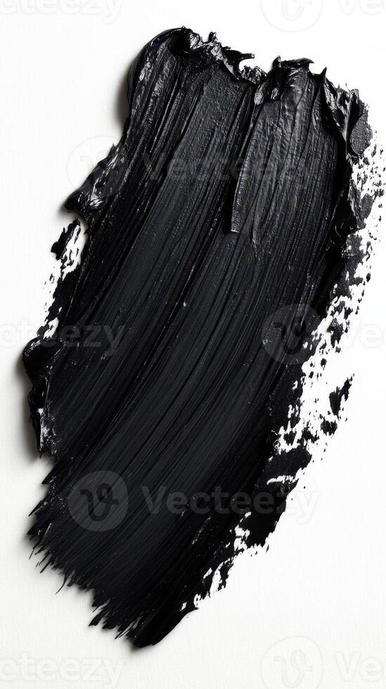 Glossy black paint texture spread across a canvas creating an artistic effect and showcasing creativity in abstract art photo