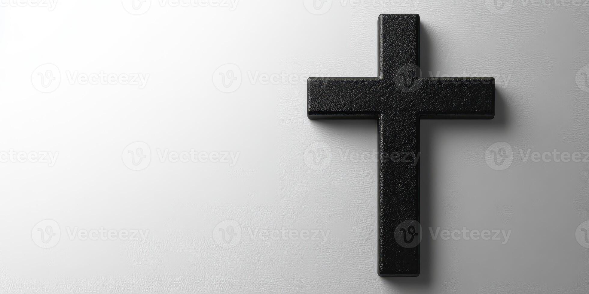 Black cross placed against a soft white background creating an impactful visual statement of faith photo
