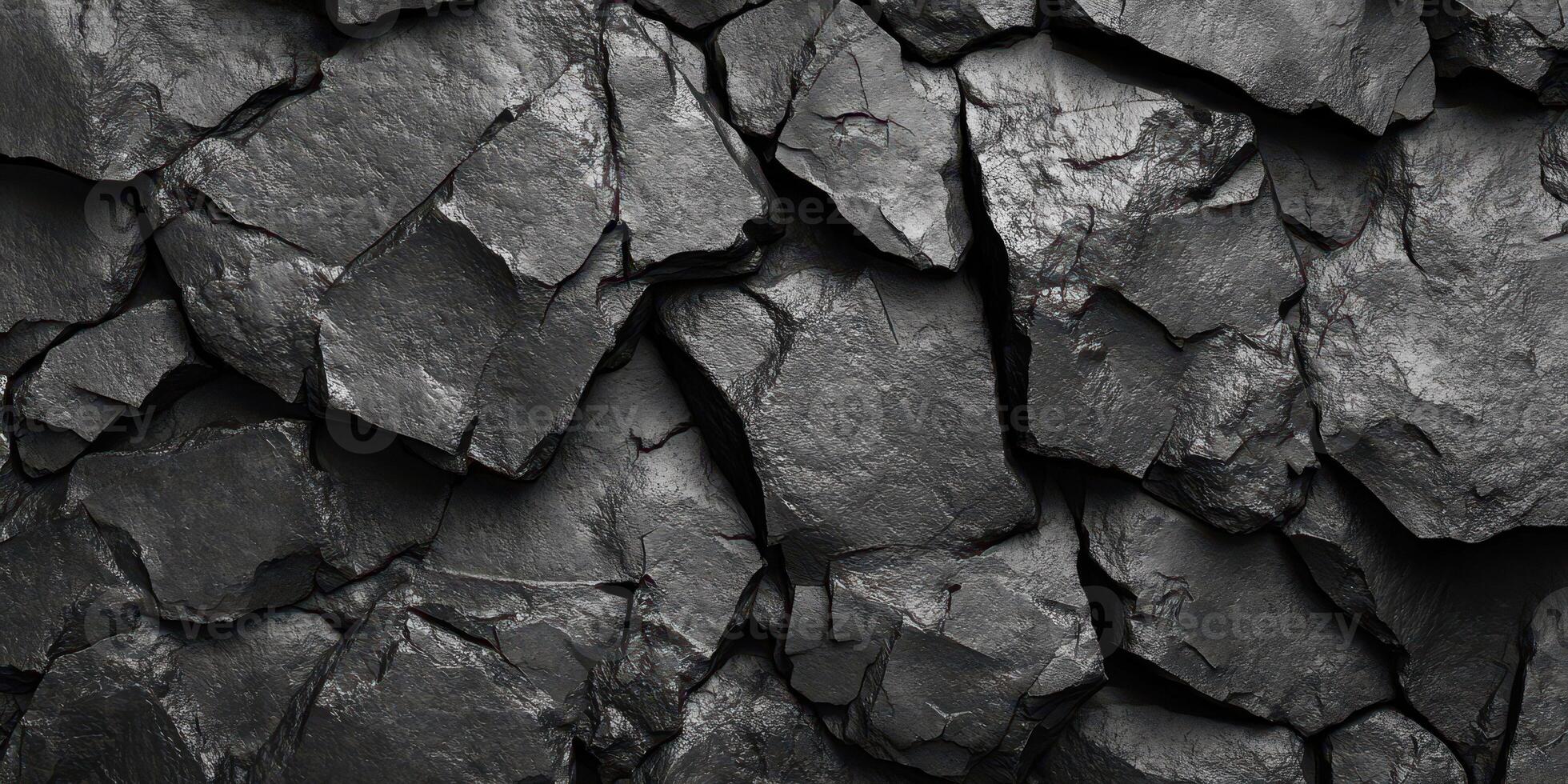 Dark textured stones arranged closely creates an interesting backdrop for various design projects or artistic expressions photo