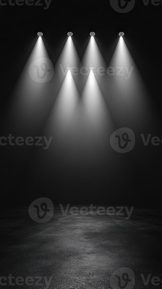 Spotlights illuminate a dark stage in preparation for a performance or event photo