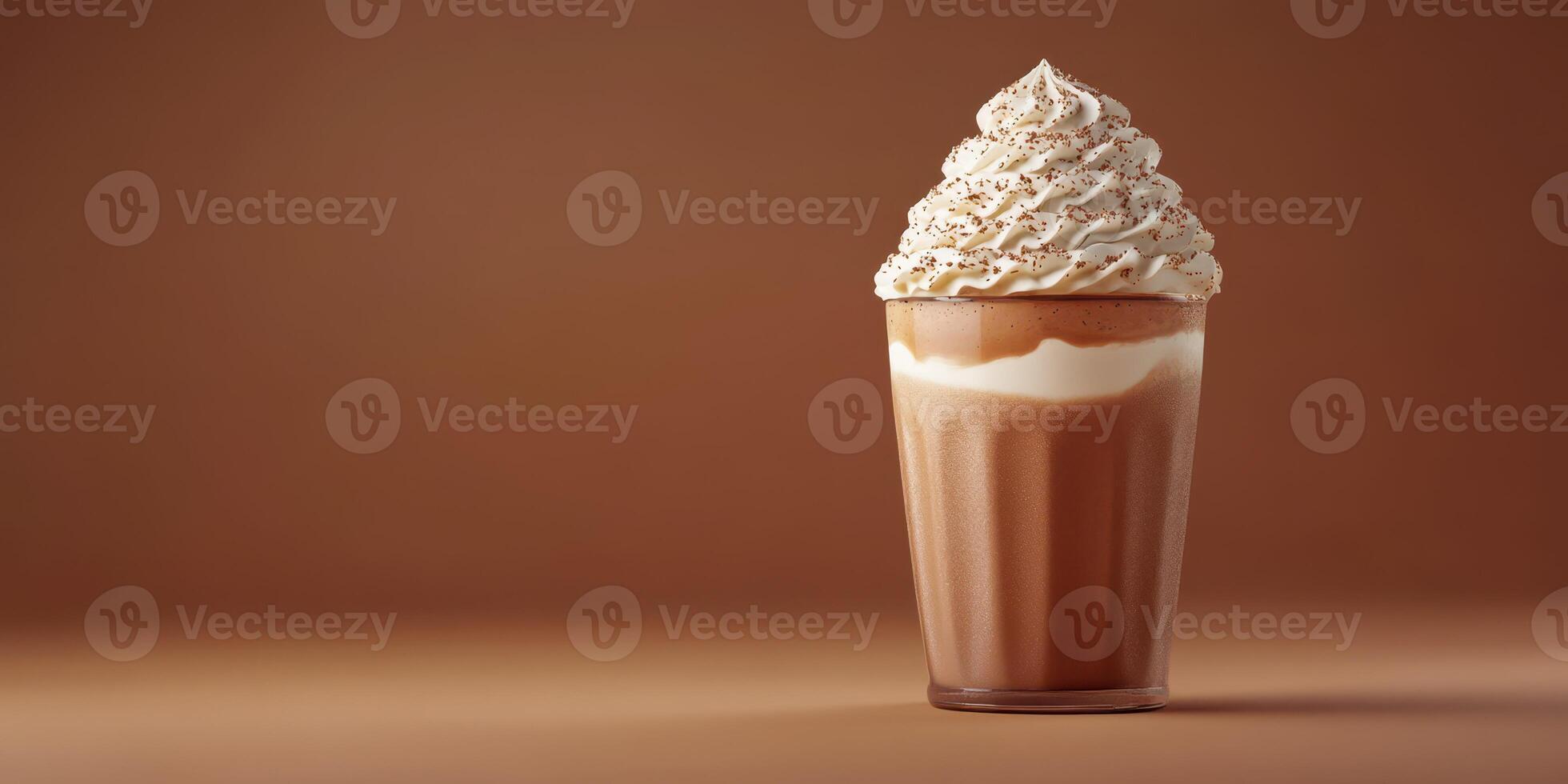 Delicious milkshake topped with whipped cream served in a clear glass against a simple brown background photo