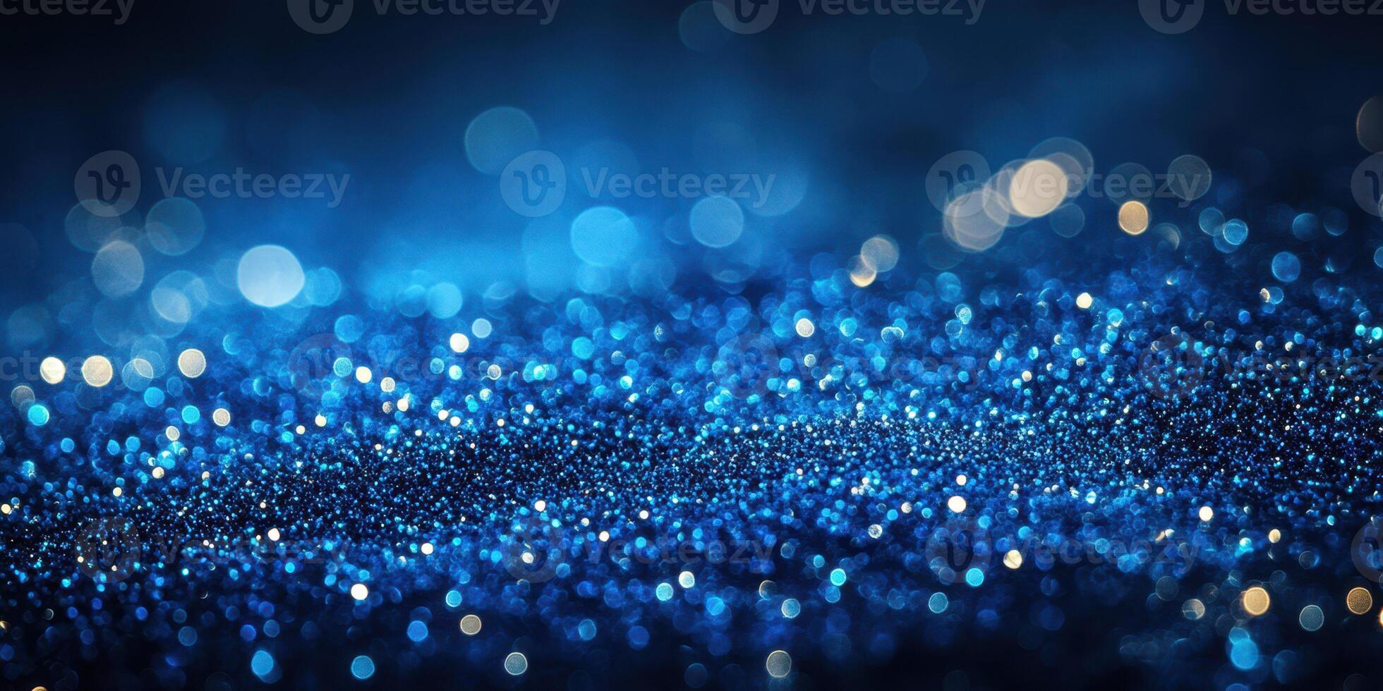 Captivating blue glitter sparkles create a mesmerizing atmosphere during a night celebration or artistic event photo