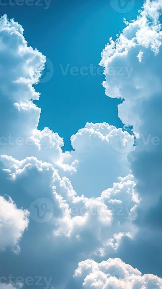 Beautiful white clouds forming intricate patterns against a bright blue sky photo
