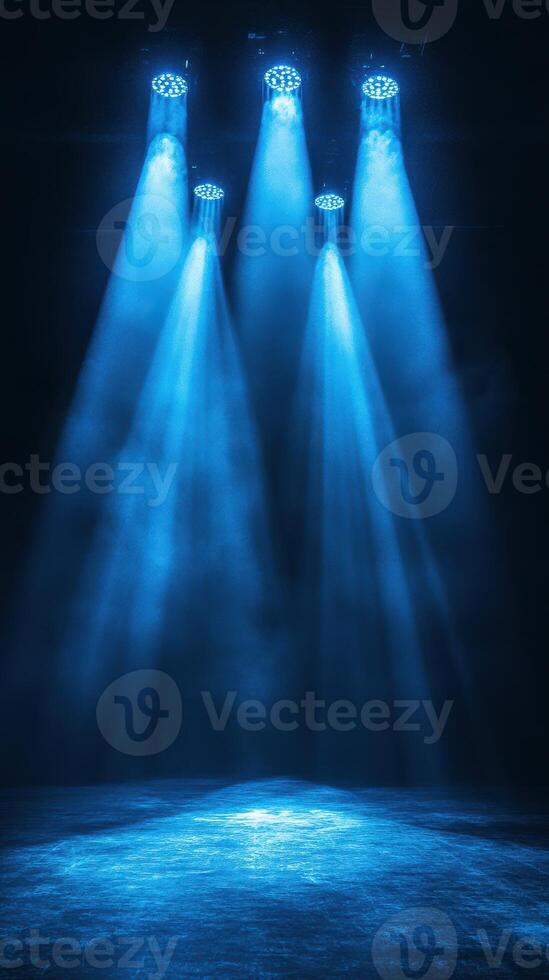 Bright blue stage lights create a dramatic atmosphere for a performance in an empty theater photo