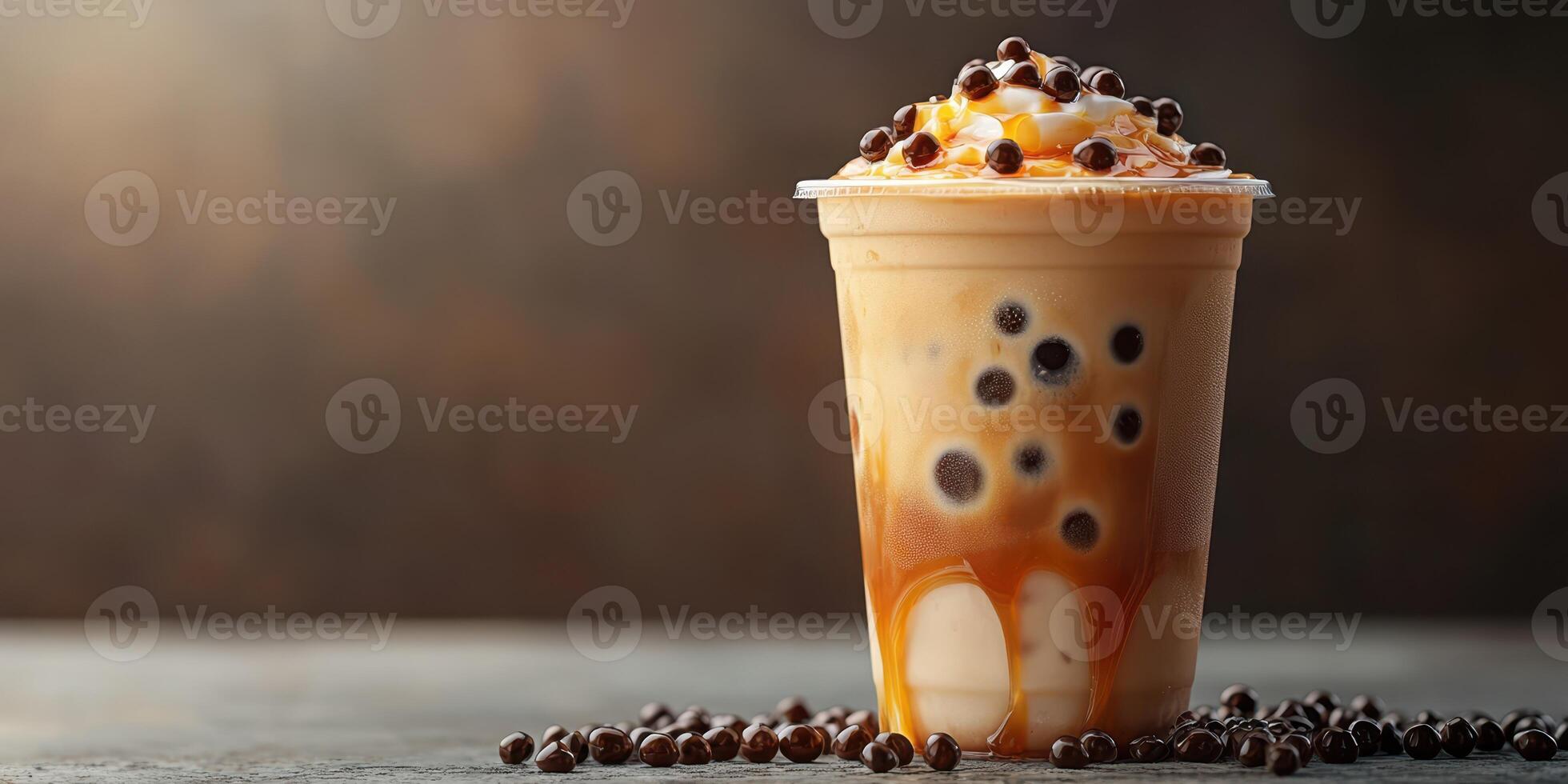 Delicious caramel bubble tea with tapioca pearls sitting on a rustic wooden table photo