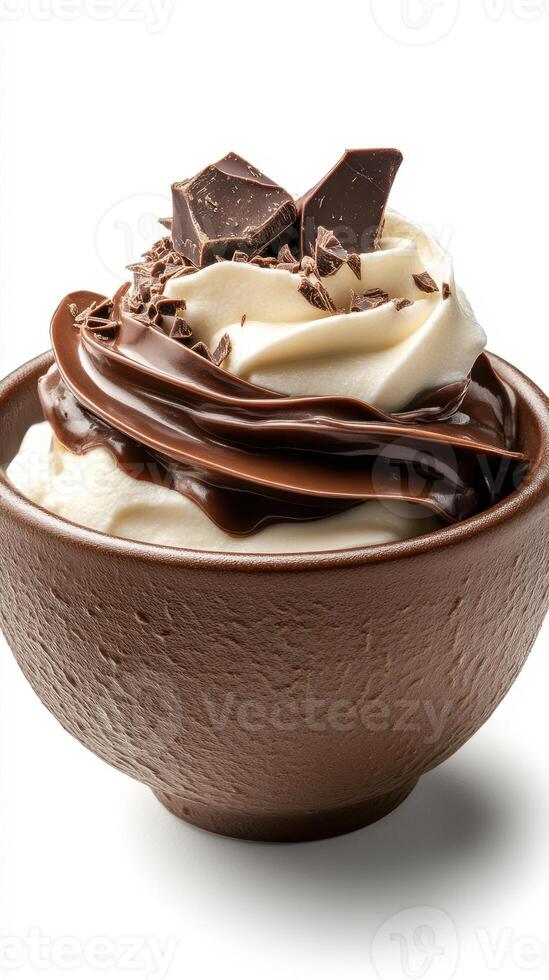 Delicious chocolate dessert topped with cream and chocolate shavings in a brown bowl photo