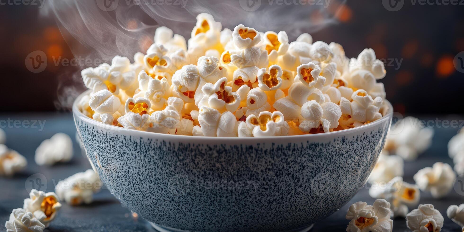 Freshly popped popcorn fills a textured bowl, creating a cozy atmosphere perfect for movie night or snack time photo