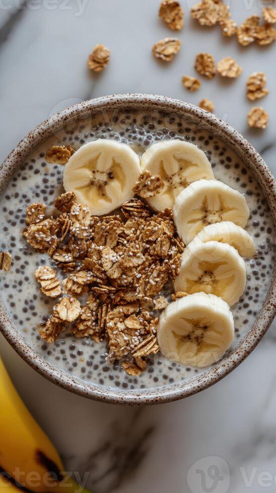 Healthy breakfast bowl featuring chia seeds, oats, and fresh banana slices for a nutritious start to the day photo