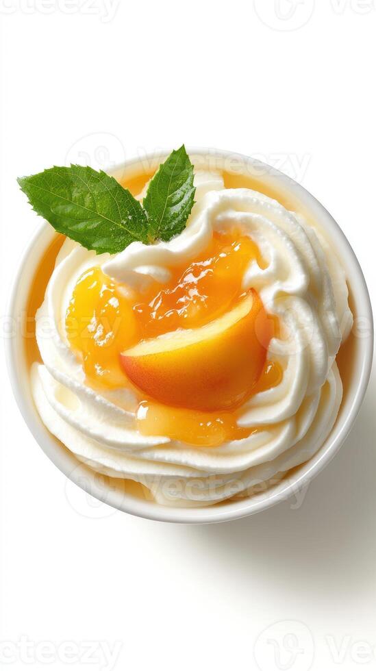 Creamy dessert with fresh peach slices and vibrant peach topping in a bowl on a white background photo
