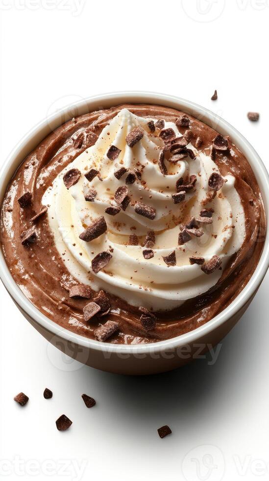 Chocolate dessert with whipped cream and chocolate shavings in a bowl on a white surface photo