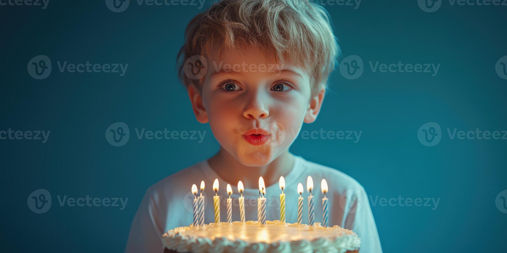 Boy blows out birthday candles on a decorated cake during joyful celebration at home photo