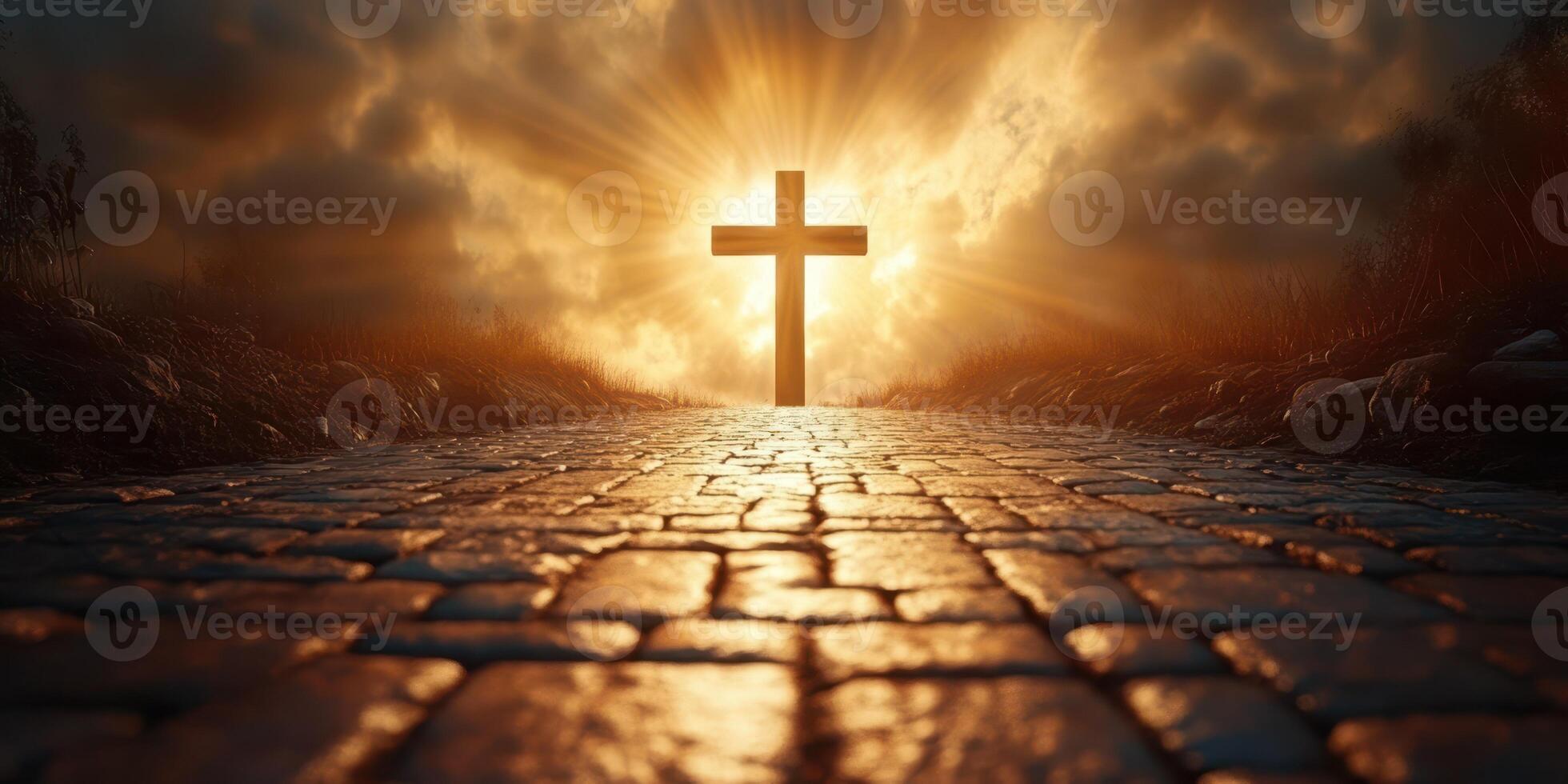Sunrise over a pathway leading to a cross illuminated by golden light in a serene landscape photo