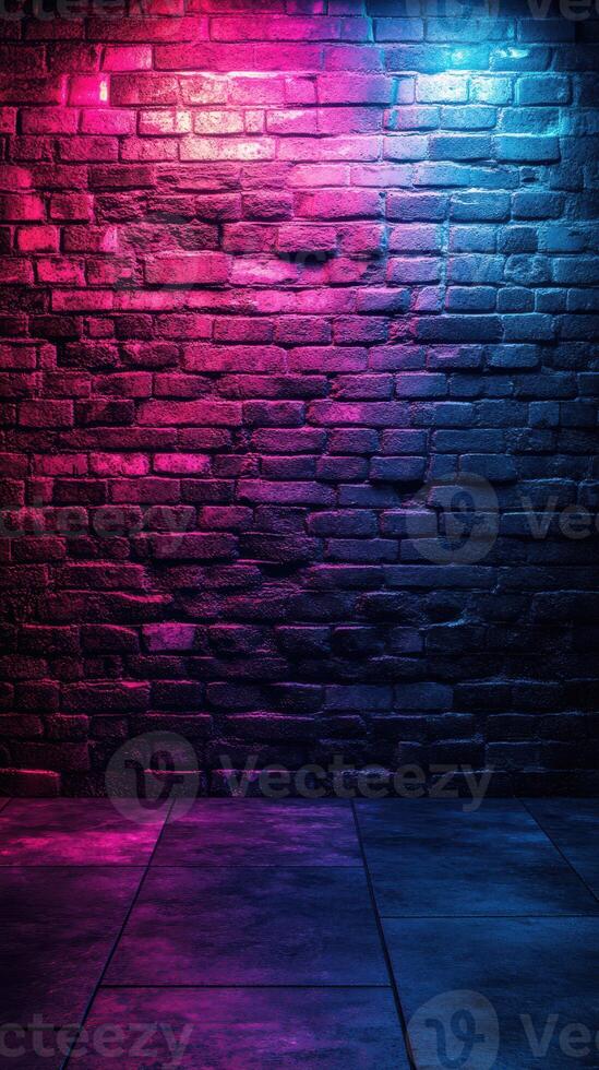 Bright pink and blue lights illuminate a textured brick wall in a darkened space creating a vivid atmosphere photo