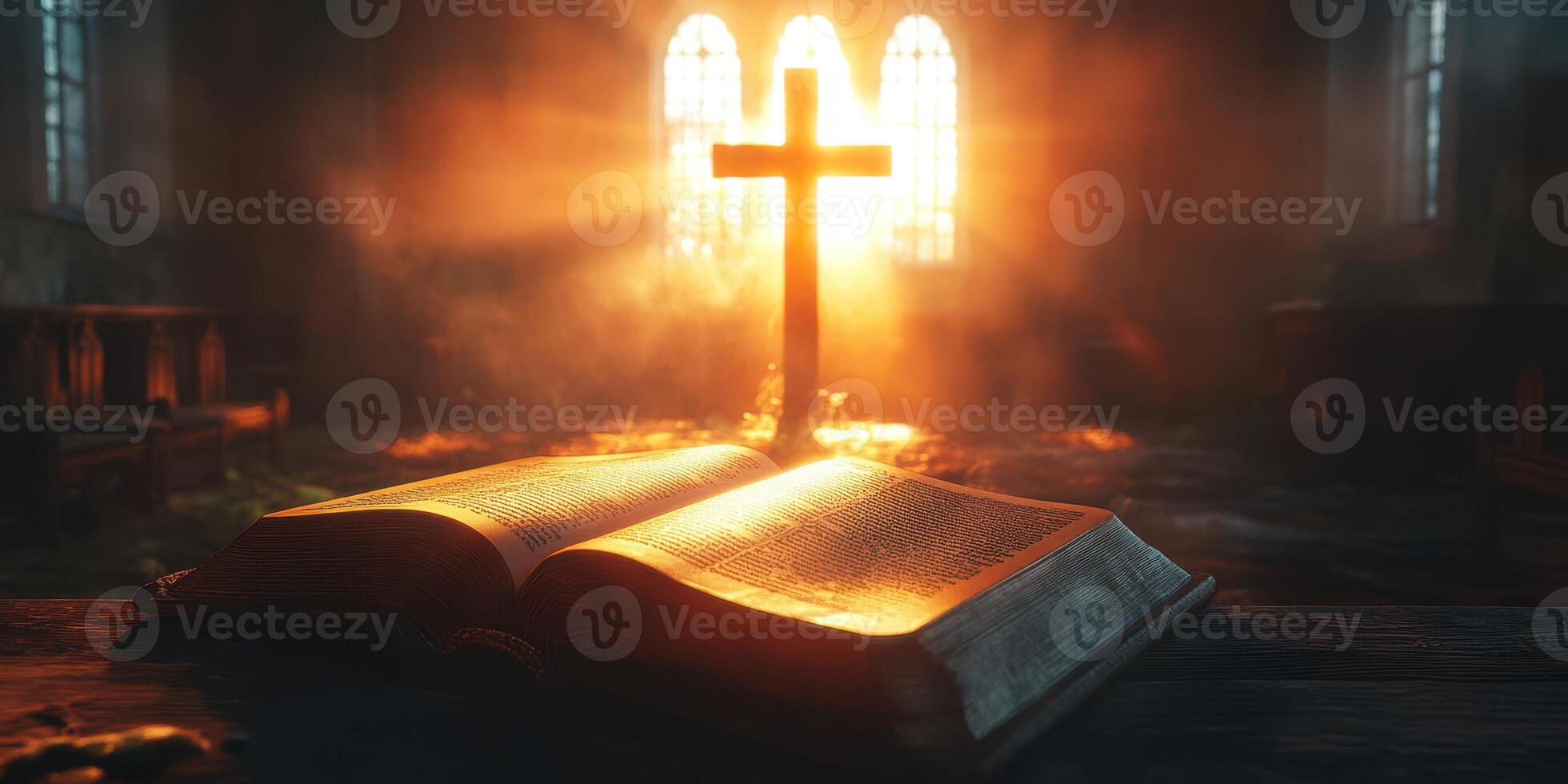 Open book resting on a wooden table with a glowing cross in the background illuminating the space photo