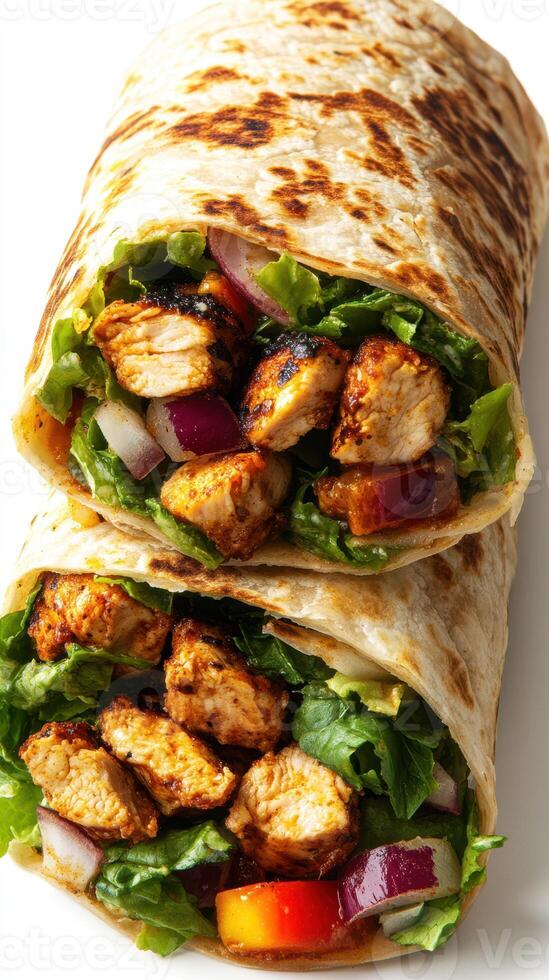 Delicious grilled chicken wraps filled with fresh vegetables and served on warm flatbread photo