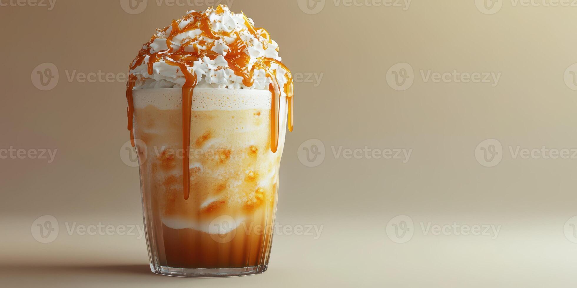 Delicious caramel coffee drink topped with whipped cream and caramel drizzle in a clear glass photo