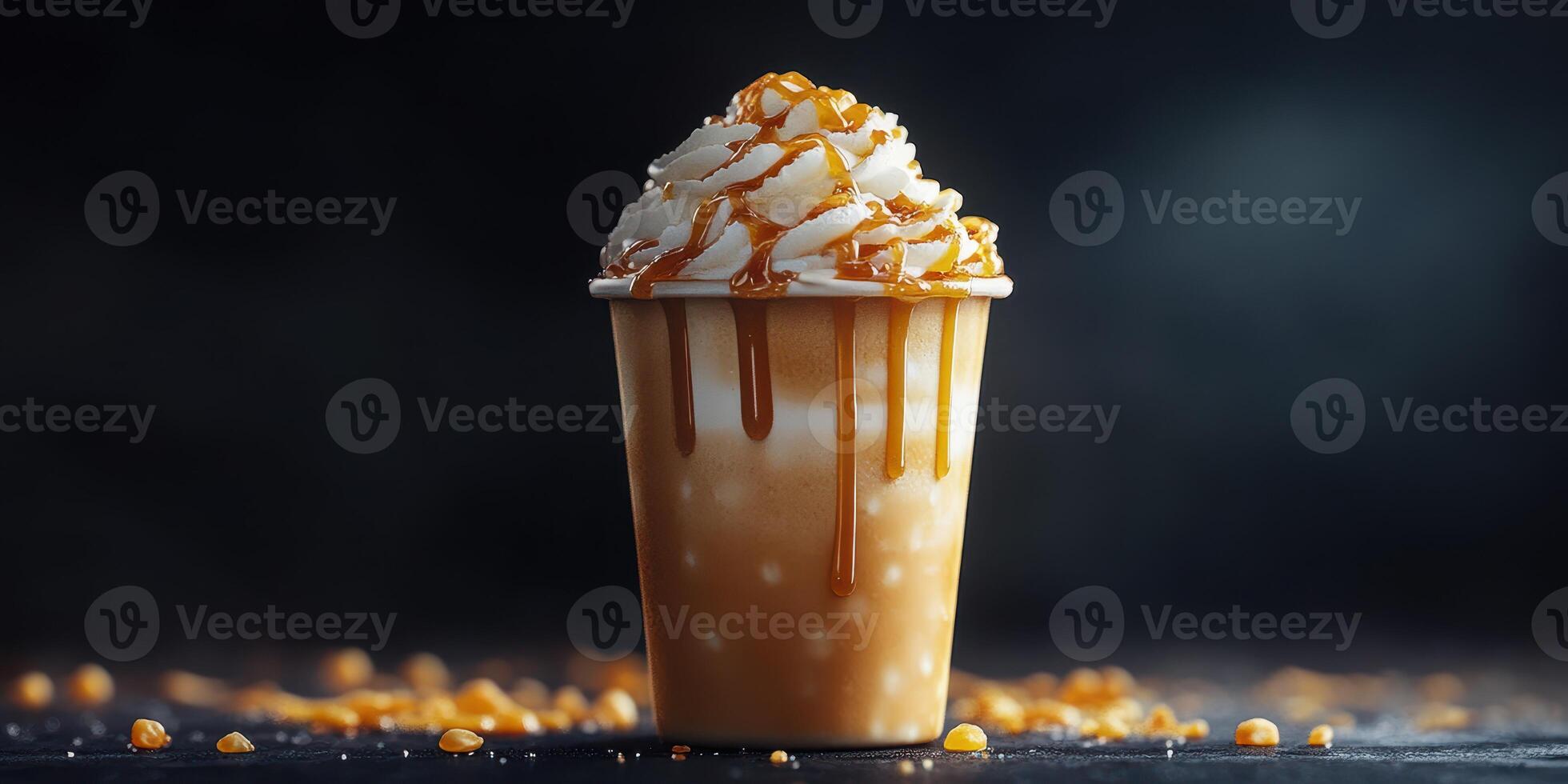 Delicious caramel topped frozen beverage served in a cup with whipped cream and colorful sprinkles in a dimly lit setting photo