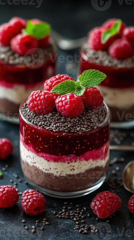 Decadent chocolate raspberry dessert cups with layers of cream and chia seeds photo
