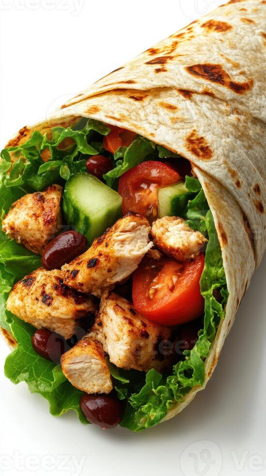 Delicious grilled chicken wrap filled with fresh vegetables, served in a soft tortilla, perfect for a healthy meal photo