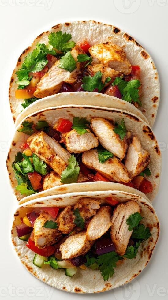 Deliciously prepared chicken tacos with fresh vegetables and herbs ready to enjoy at a vibrant gathering photo