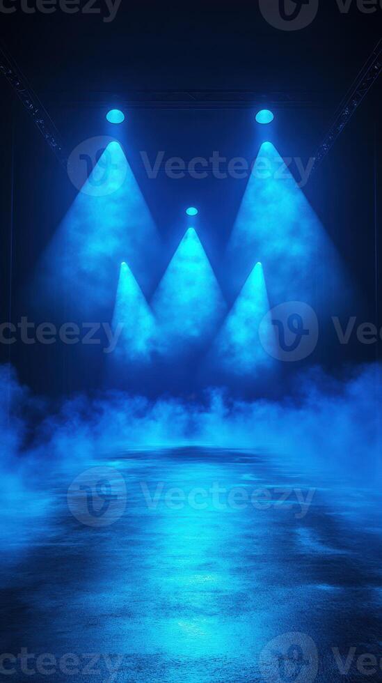 Blue lighting illuminates a foggy stage preparing for a live performance in a darkened venue photo