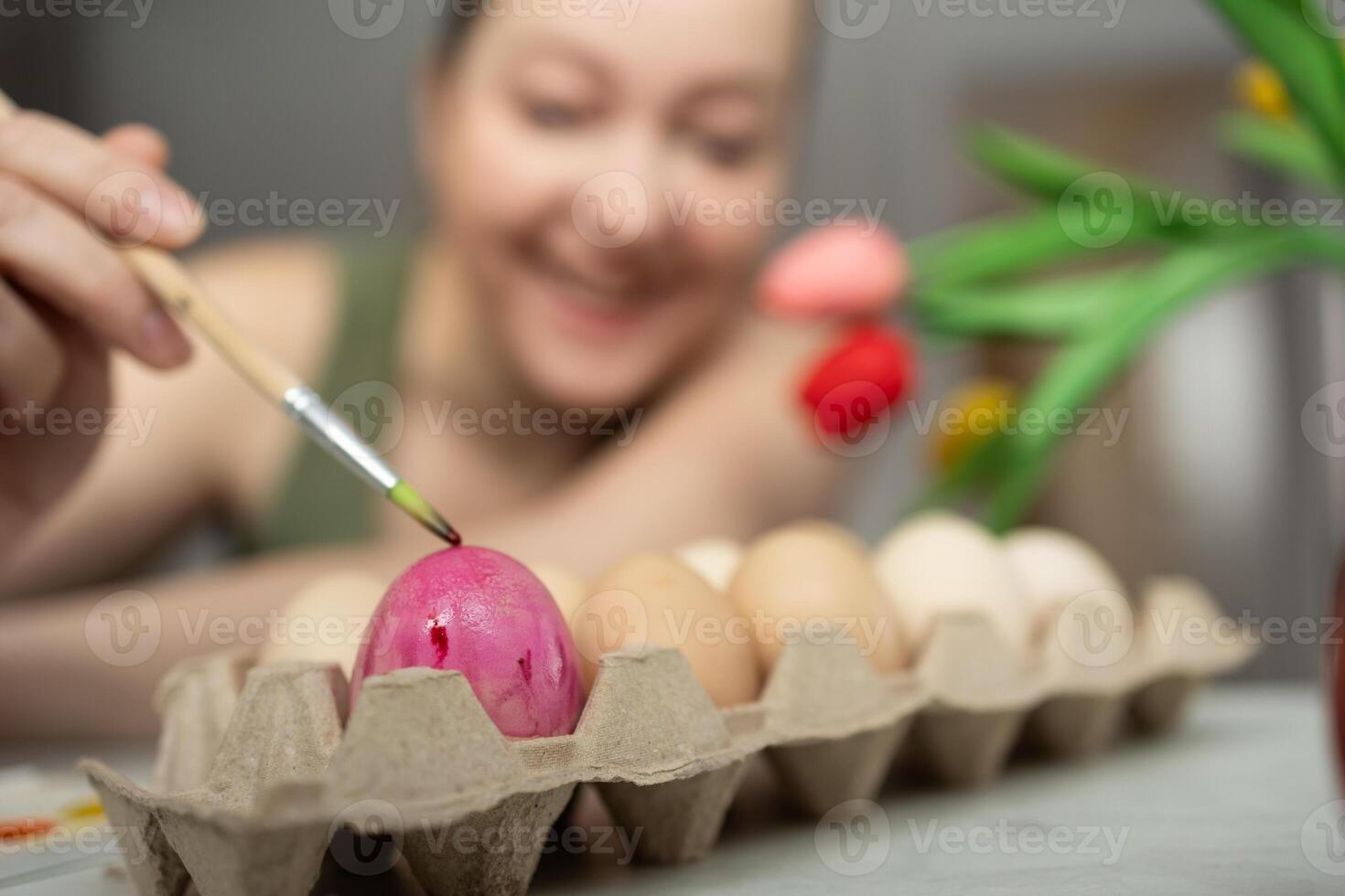 Engaging in the Creative Process of Decorating Easter Eggs Using Bright and Vibrant Colors photo