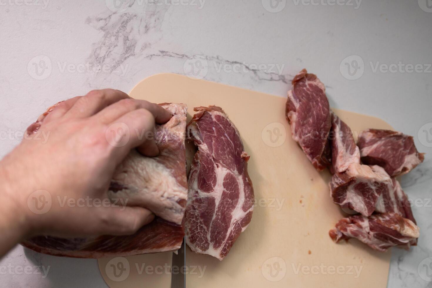 Freshly Cut Pork Meat Placed on a Chopping Board Ready for Preparation and Cooking photo