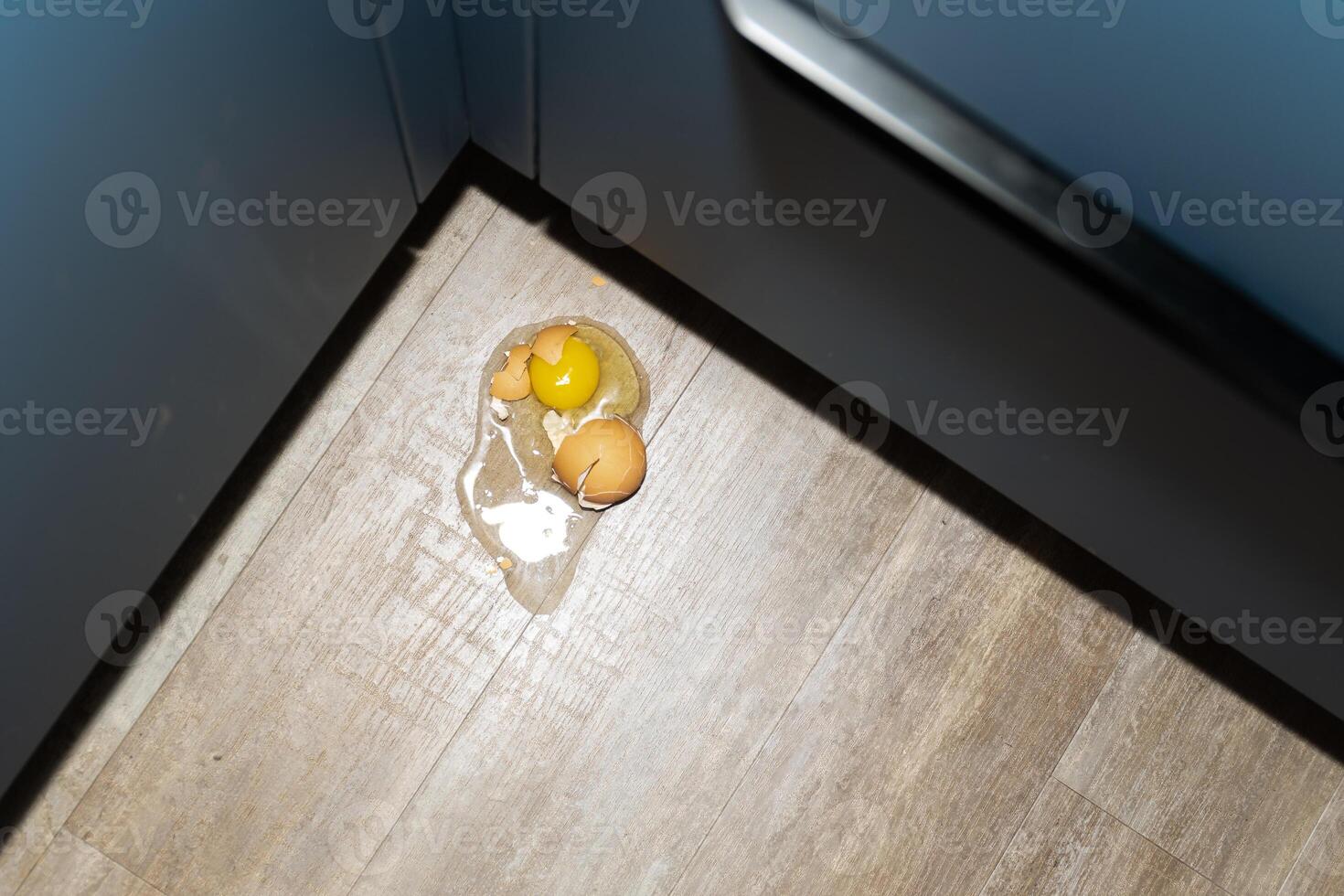 A mishap involving spilled eggs occurred in the corner of the kitchen , creating a mess photo