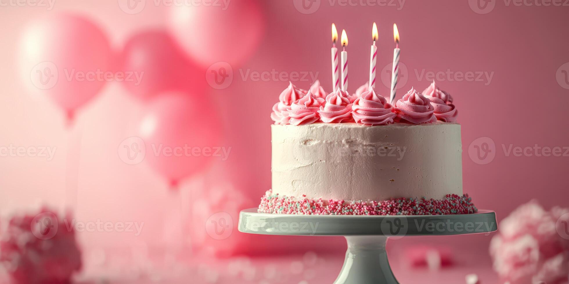 Delicate pink birthday cake with candles and balloons celebrating a joyful occasion photo