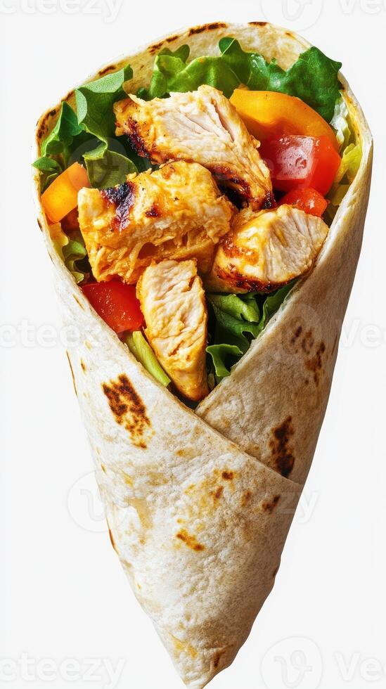 Grilled chicken wrap filled with fresh vegetables served on a plain background at a casual dining setting photo