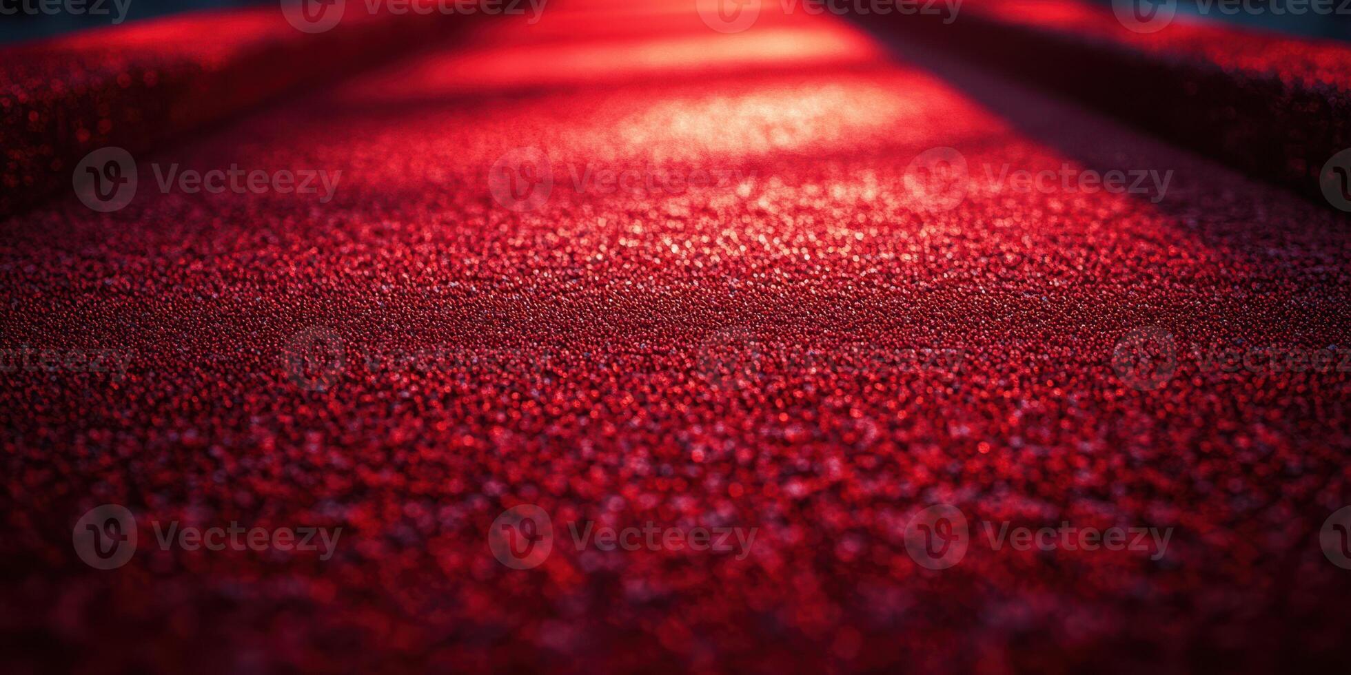 Bright red textured surface in outdoor setting during the evening light revealing intricate patterns and details photo
