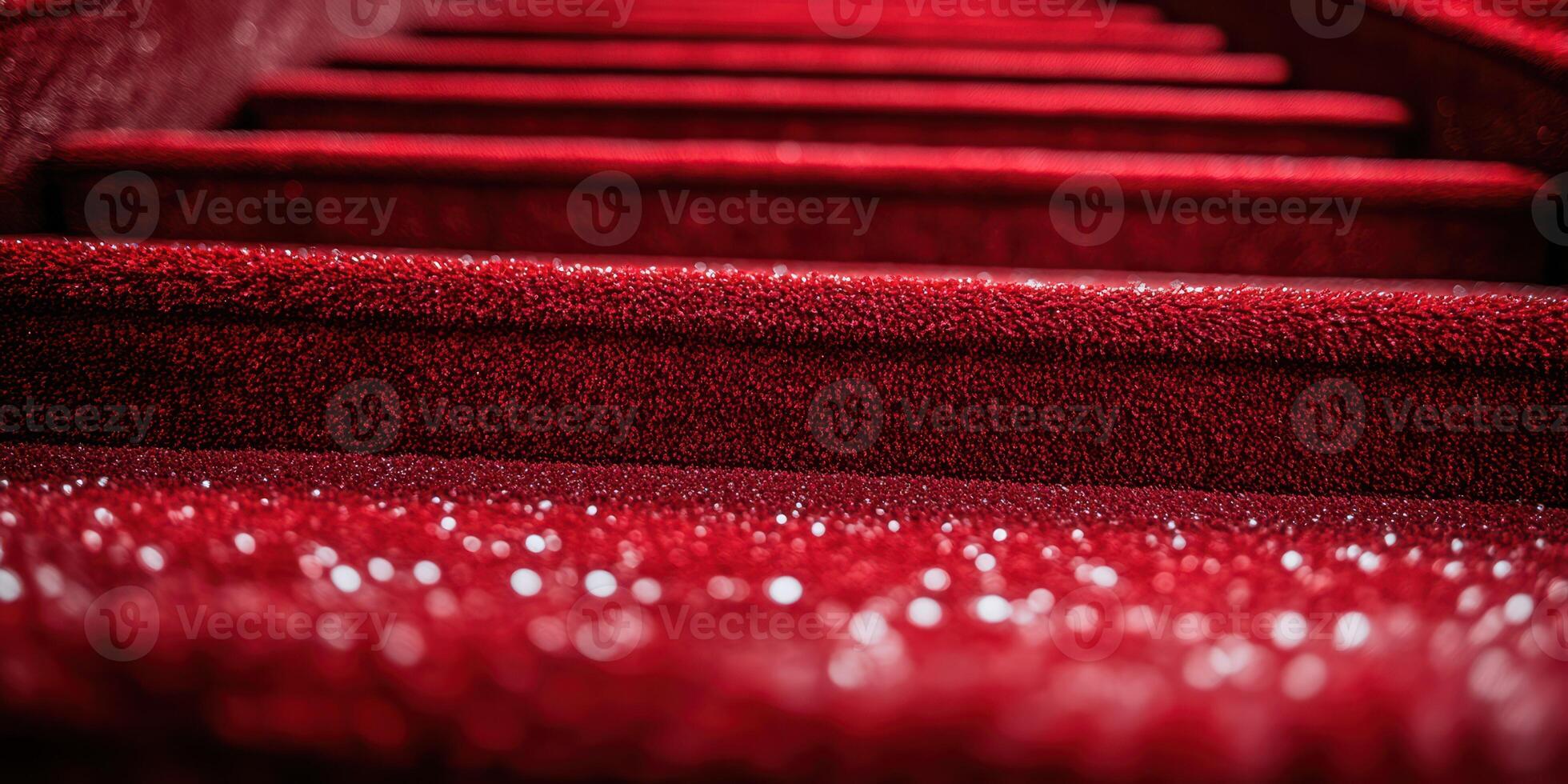 Red carpet leading upward in a glamorous setting during an evening event photo