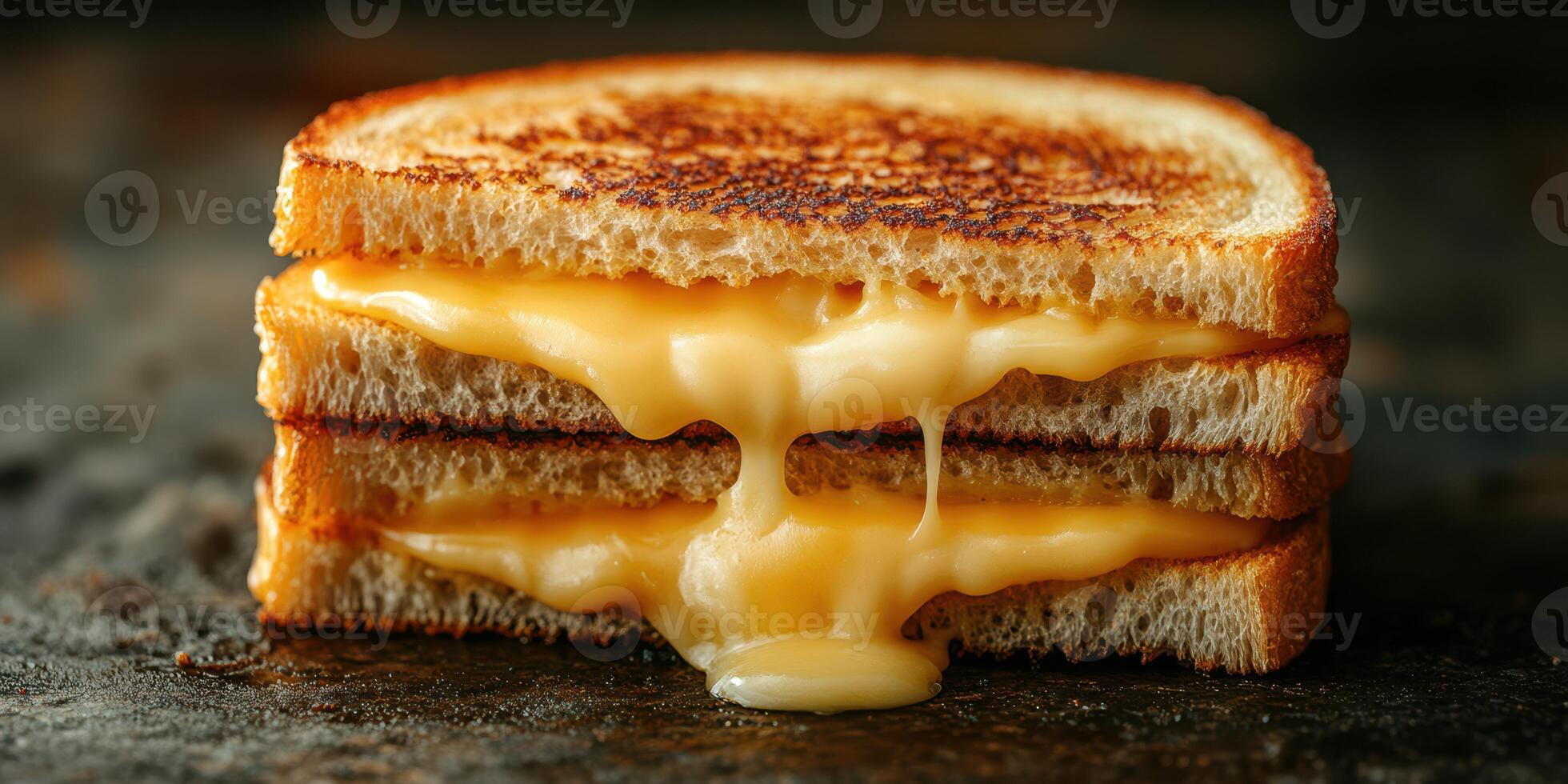 Delicious melted cheese sandwich stacked on toasted bread served on a rustic wooden surface photo