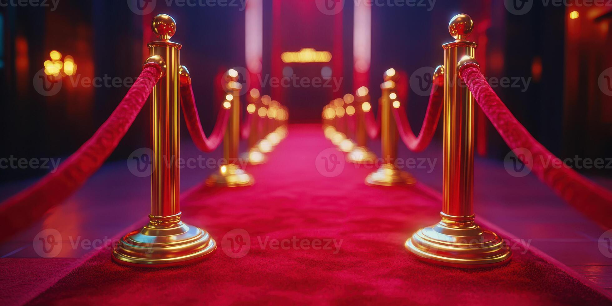 Red carpet pathway lined with gold stanchions leading to a glamorous event venue at night photo