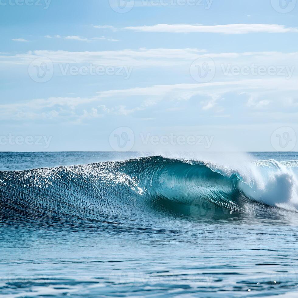 Blue ocean wave with white foam and blue sky in the background. Abstract background with waves. photo